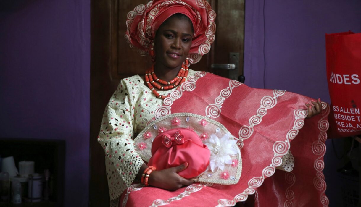 sunlola ogungbadero, dressed in traditional attire, poses for a photograph before the start of her traditional wedding in surulere district, nigeria's lagos