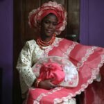sunlola ogungbadero, dressed in traditional attire, poses for a photograph before the start of her traditional wedding in surulere district, nigeria's lagos