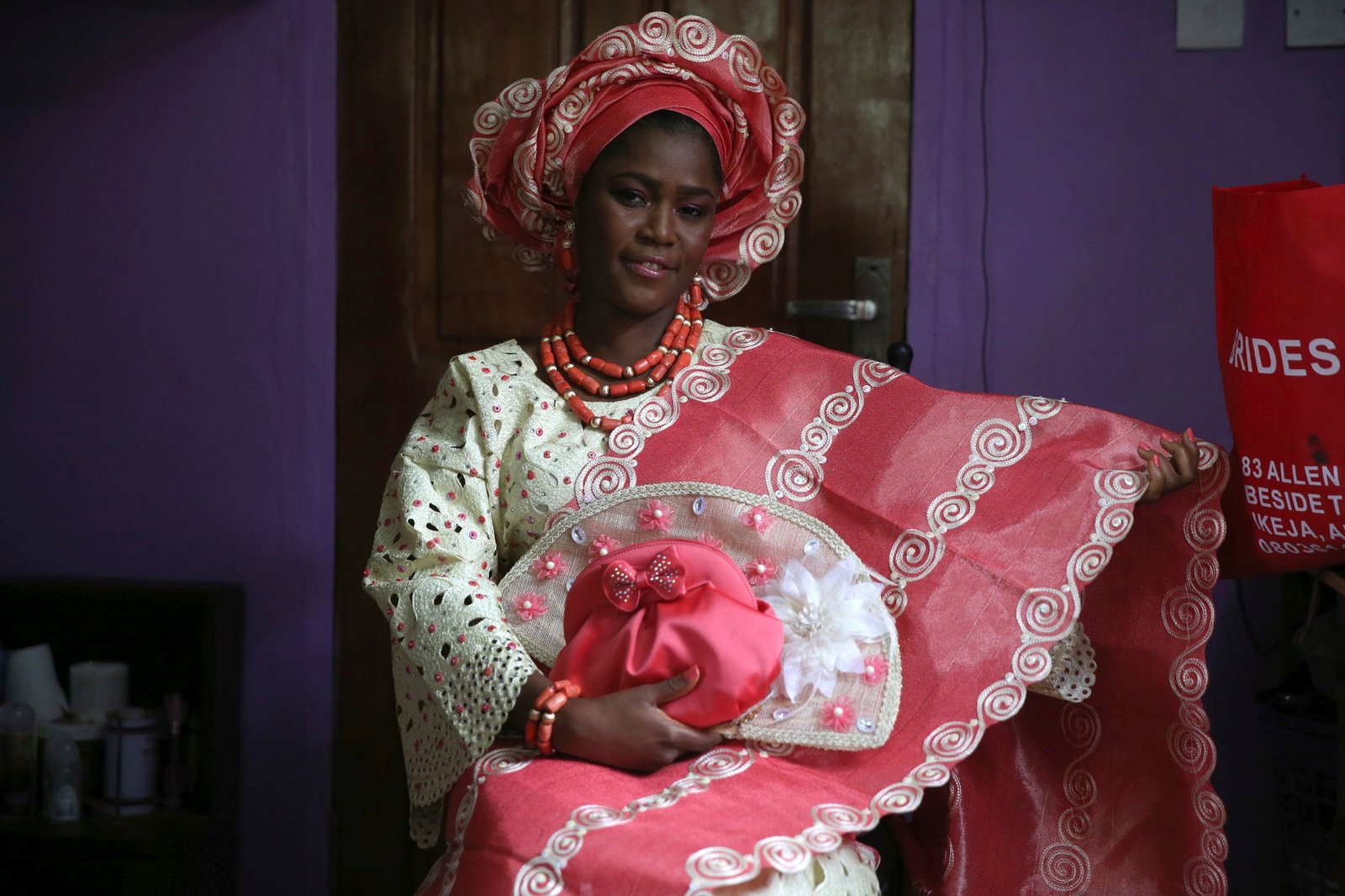 sunlola ogungbadero, dressed in traditional attire, poses for a photograph before the start of her traditional wedding in surulere district, nigeria's lagos