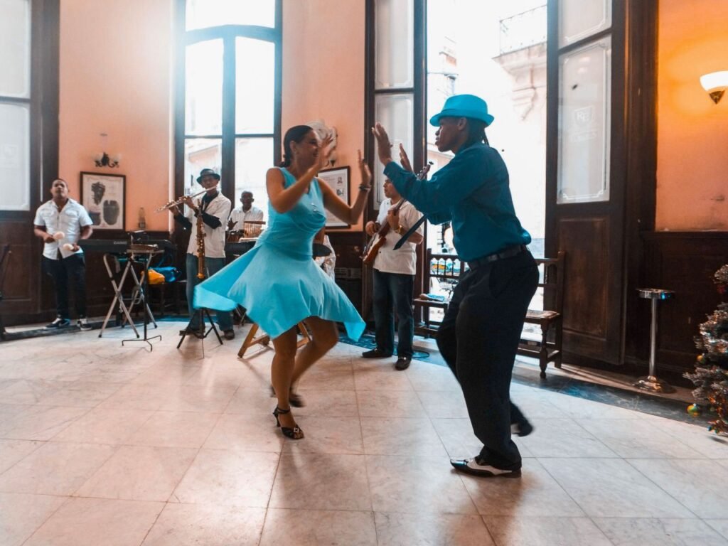 a lively dance performance capturing joy and rhythm in a bustling café with live musicians havana, cuba