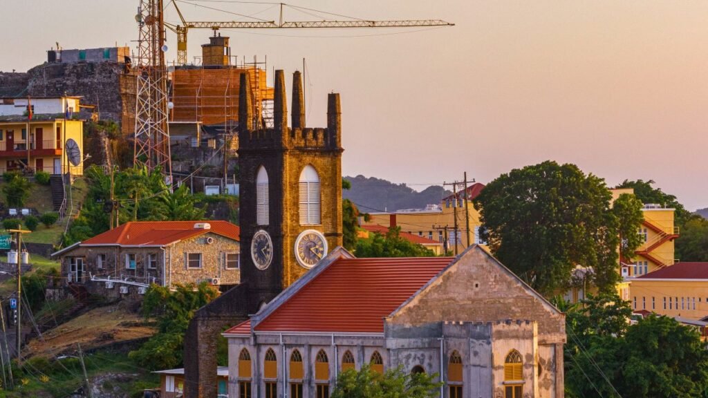 aerial shot of a historic cathedral amidst an urban setting at sunset, featuring colorful architecture grenada