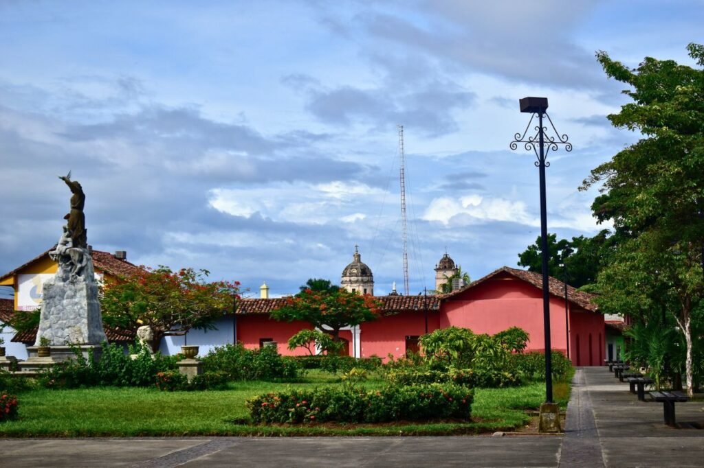 colonial architecture and statue in a scenic town square on a cloudy day. honduras
