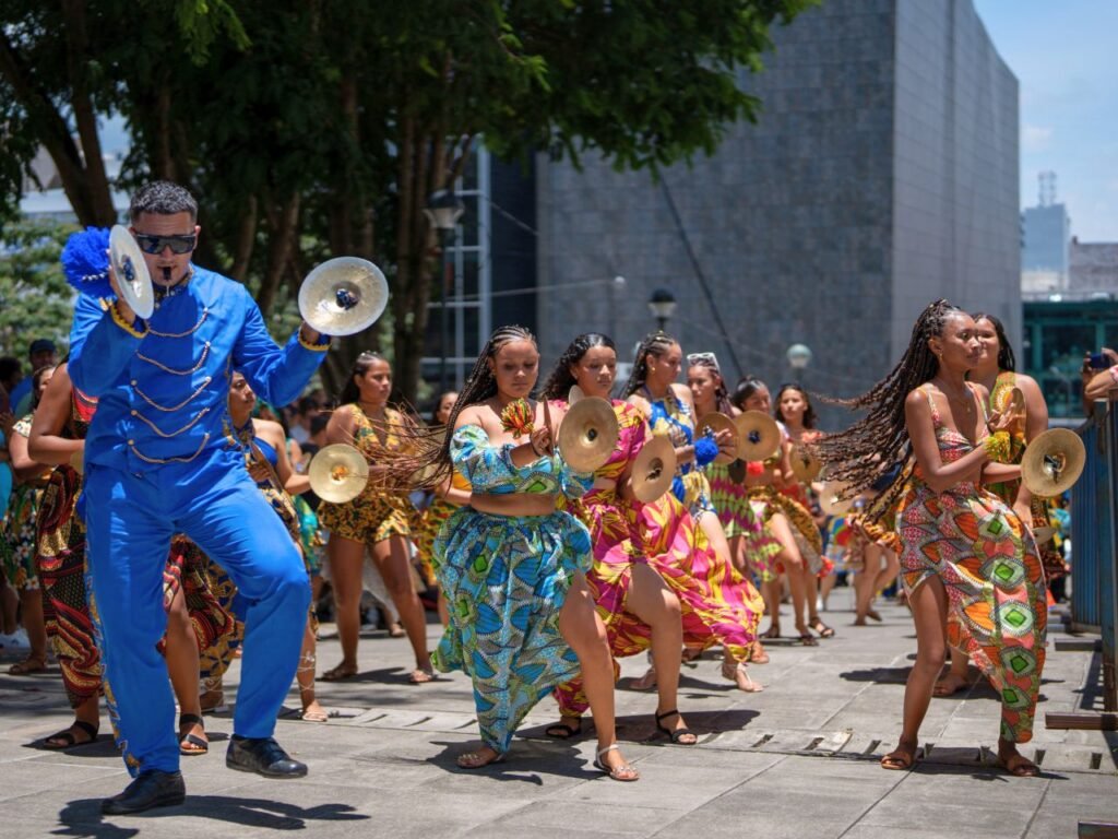 colorful dancers and musicians celebrate in the streets of san josé, costa rica, embodying cultural joy.