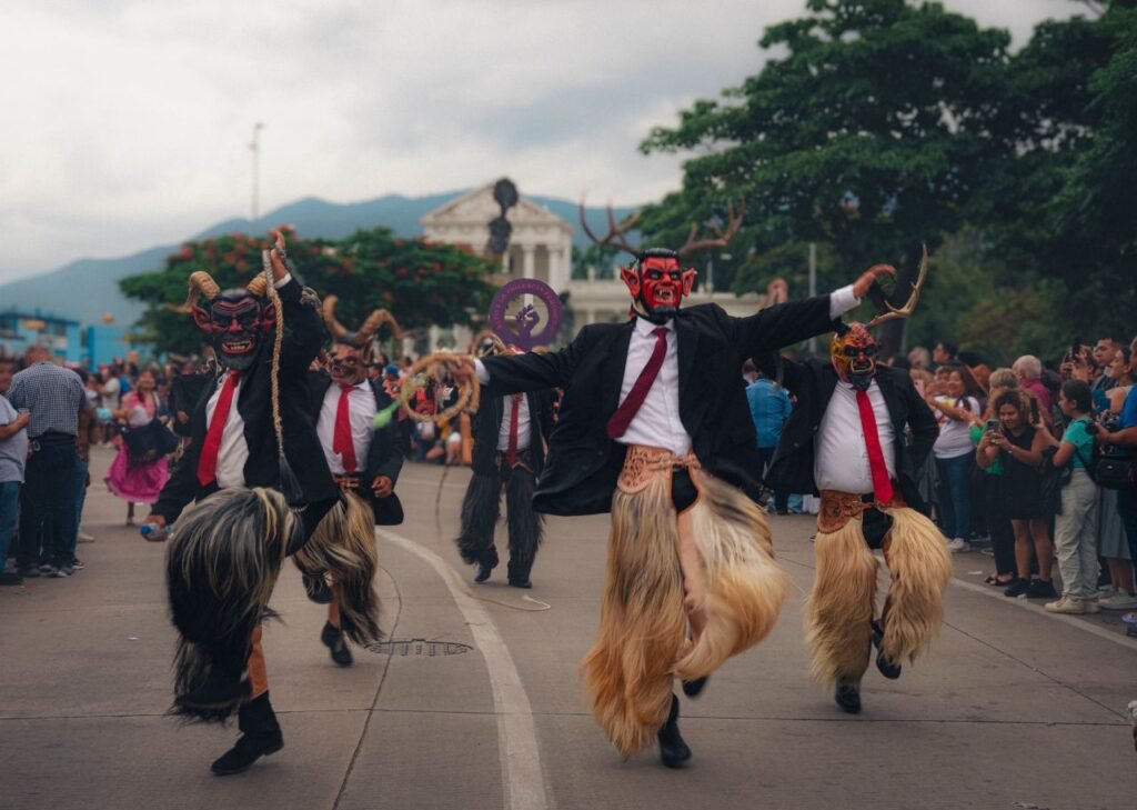 masked performers dance in a vibrant street festival with cultural costumes san josé, costa rica