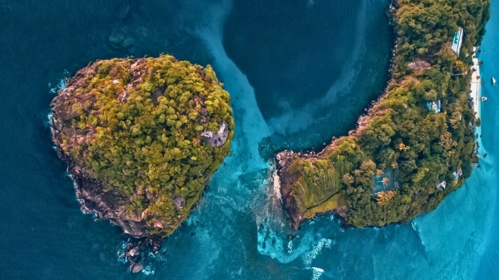 a breathtaking aerial view showcasing the lush greenery and turquoise waters of saint vincent and the grenadines.