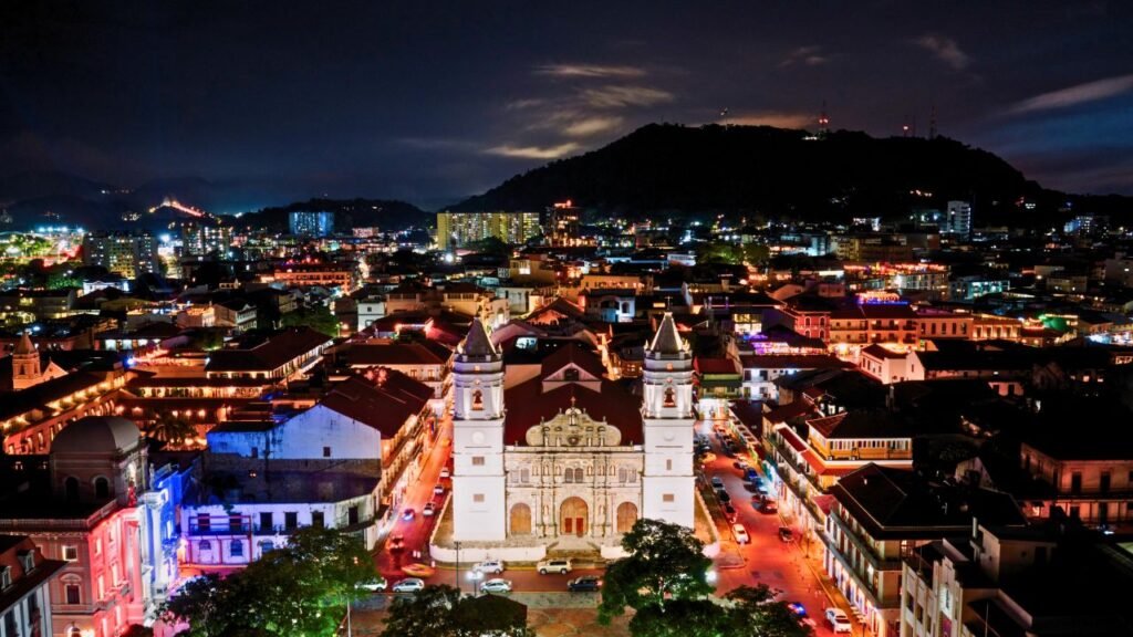 a captivating aerial view of panama city's casco viejo at night, illuminated by vibrant city lights. panama city, panamá province, panama
