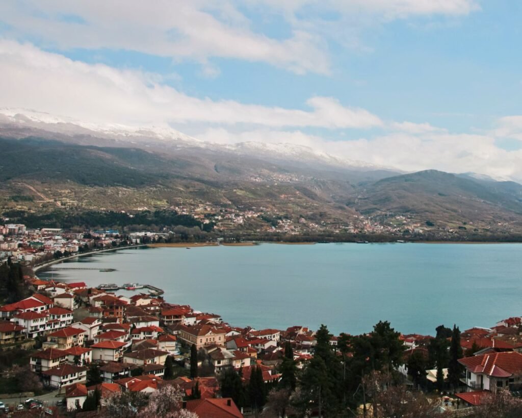 aerial view of the picturesque ohrid lake with surrounding mountains and red rooftops ohrid, north macedonia