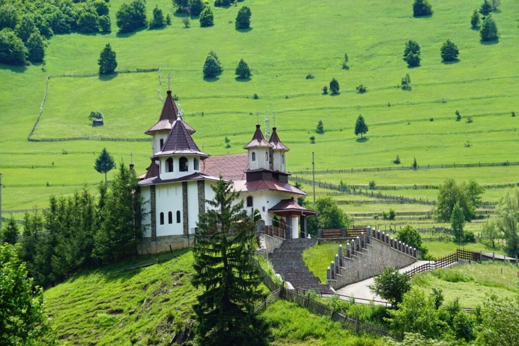 beautiful countryside church set amidst a vibrant green landscape in summer romania
