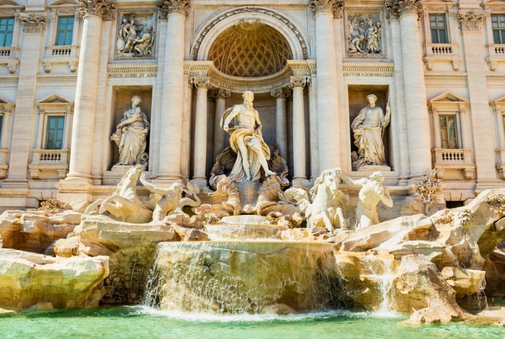 beautiful daylight view of the iconic trevi fountain in rome, featuring exquisite sculptures and flowing water