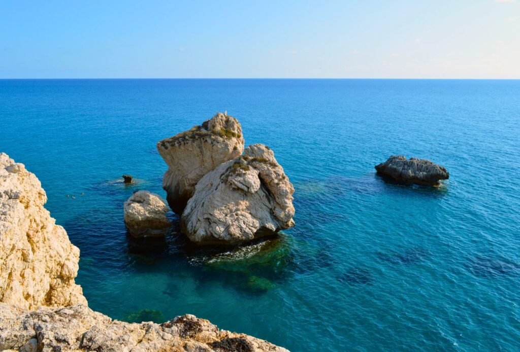 beautiful view of aphrodite's rock in cyprus, showcasing the serene blue ocean and rugged formations kouklia, cyprus