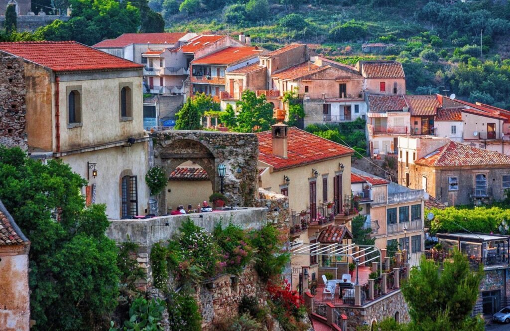 charming old town in sicily with red rooftops and lush greenery, perfect for travel and exploration sicily, italy