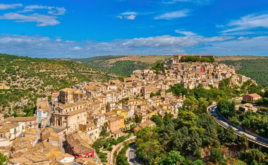 explore the stunning medieval architecture of ragusa ibla in picturesque sicily, italy, with this vibrant aerial view