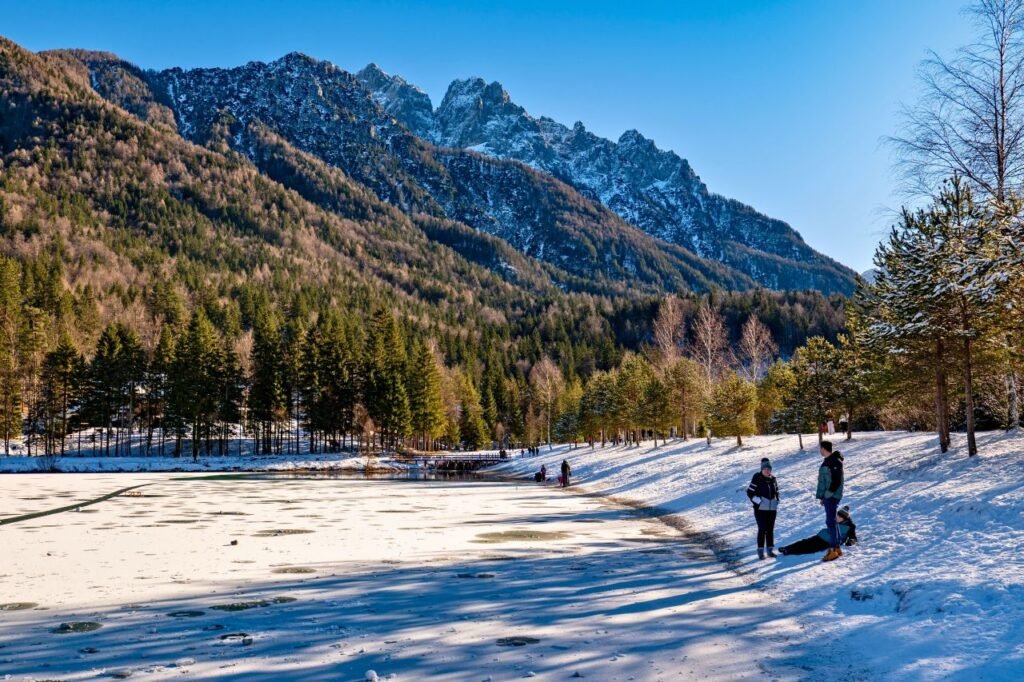 scenic winter view of snow covered landscape with mountains and trees in kranjska gora, slovenia.